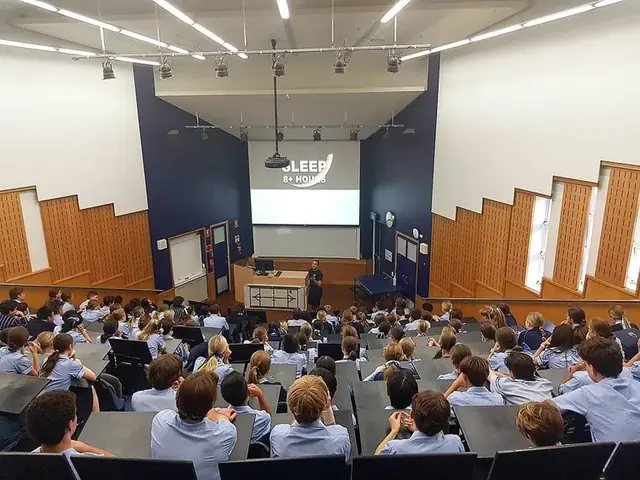 A Simple Six presentation in a school hall